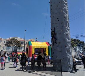 Photo of bounce house and rock climbing at Spring Fair